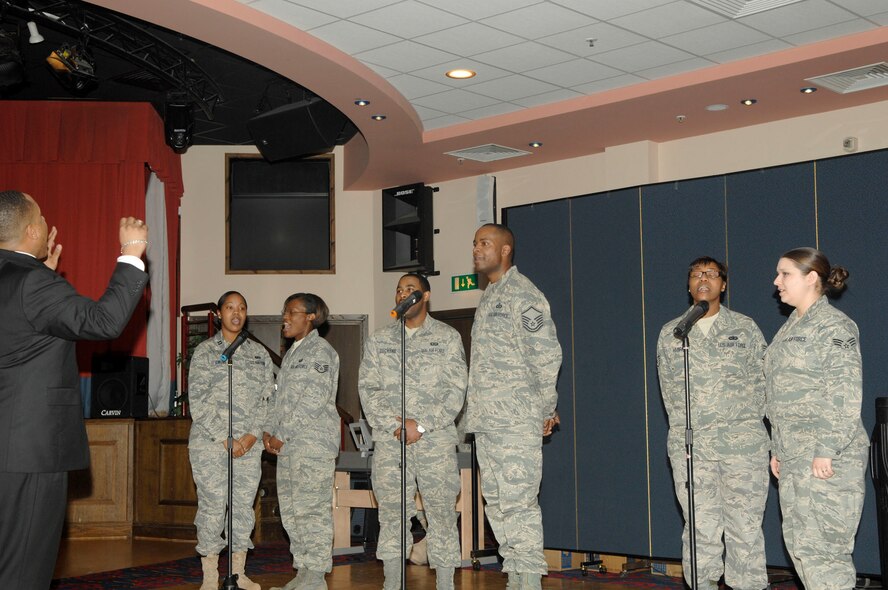 Members of the Rev. Dr. Martin Luther King, Jr. celebration committee sing during a luncheon in his honor at RAF Mildenhall Thursday. Col. Sharon Holmes, 422nd Air Base Group commander at RAF Croughton was the guest speaker for the event where more than 200 people were in attendance. (U.S. Air Force Photo by Airman 1st Class Dwayne Lee)