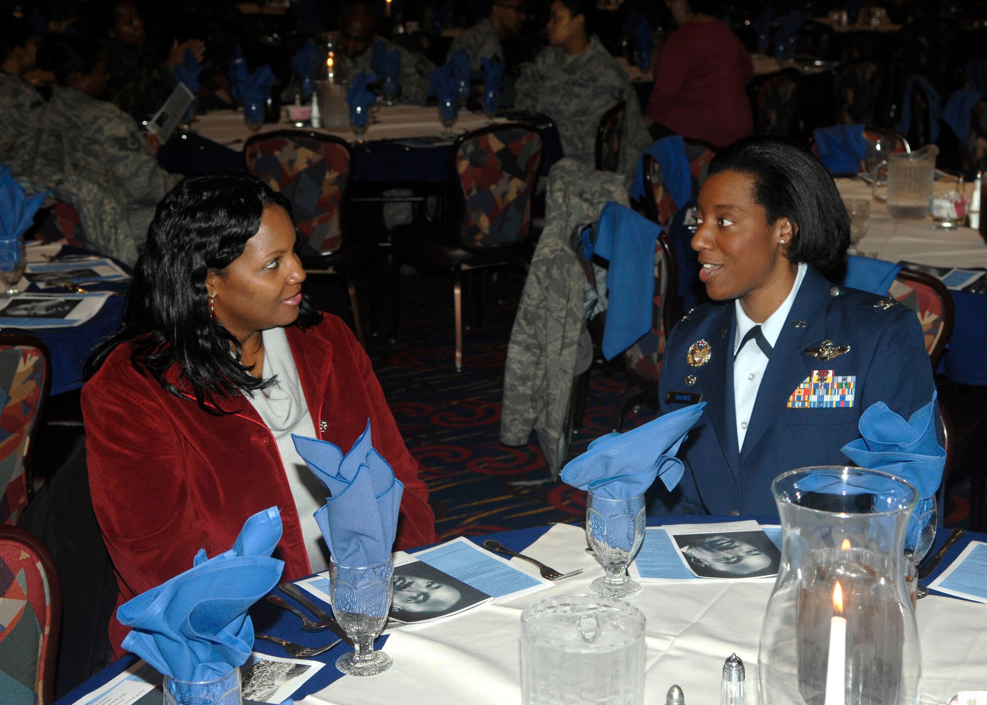 Col. Sharon Holmes, 422nd Air Base Group commander at RAF Croughton talks with Patricia Cotton, a Community Readiness Consultant at the RAF Mildenhall Airman and Family Readiness Center prior to the Rev. Dr. Martin Luther King  Jr. celebration luncheon at RAF Mildenhall Thursday. Col. Holmes was the guest speaker for the event where more than 200 people were in attendance. (U.S. Air Force Photo by Master Sgt. Charles Tubbs)
