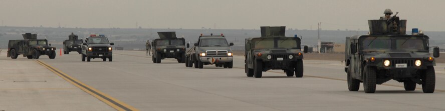 A convoy of 39th Security Forces vehicles escort a truck hauling munitions to its destination during an exercise, Jan. 16. Exercises are held monthly at Incirlik to maintain combat readiness. (U.S. Air Force photo/Senior Airman Benjamin Wilson)