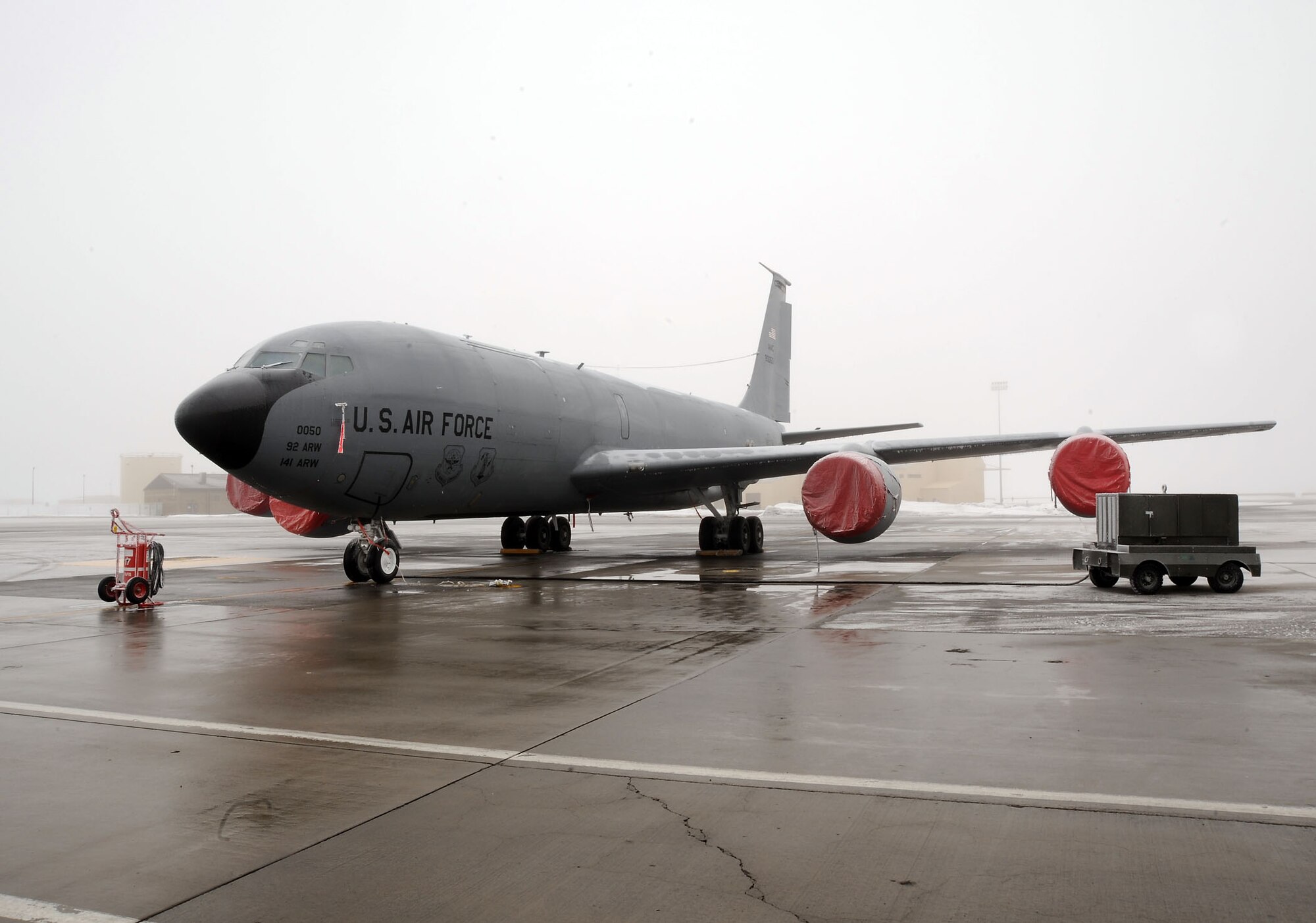 FAIRCHILD AIR FORCE BASE, Wash. – Senior Airman Jordan Jensen and Airman Carlos Mercado, crew chiefs from the 92nd Aircraft Maintenance Squadron, prepare to launch a KC-135 Stratotanker on Fairchild’s flightline Jan. 22. Crew chiefs perform duties in extreme weather, ranging from extreme cold to blistering heat. (U.S. Air Force photo / Staff Sgt. JT May III)