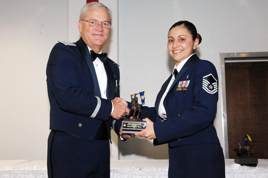 Master Sgt. Cynthia Villa of the 452 ASTS recieves her award for Senior NCO of the Year. Jan. 10, 2009 from Brig. Gen. James L. Melin, commander, 452nd Air Mobility Wing (U.S. Air Force photo by Tech. Sgt. Elizabeth Concepcion). 
