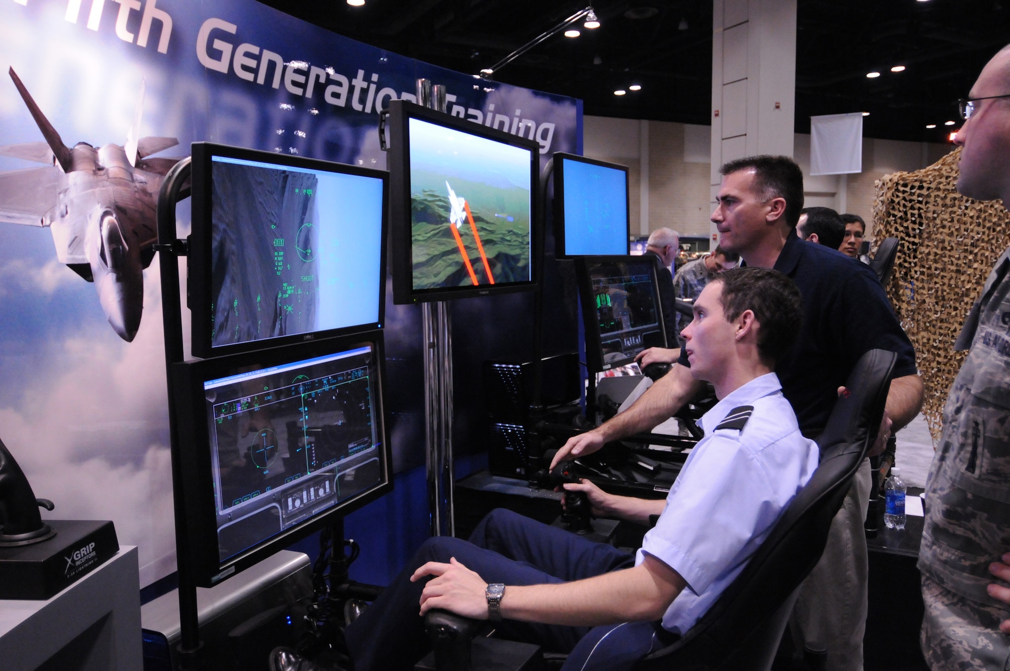 A cadet pilots a virtual F-35 Lightning II aircraft at a display at the Alamo AFA Expo. More than 100 vendors and units had displays or demonstrations at the event.