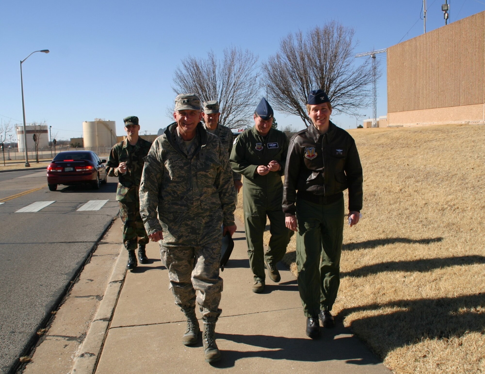 General Gillett walks down Sentry Boulevard with Col. Pat Hoffman, 552nd Air Control Wing commander, during his orientation to the wing Tuesday. General Gillett visited several areas of the wing and was briefed by members on their operations.  (Air Force photo/1st Lt. Kinder Blacke)