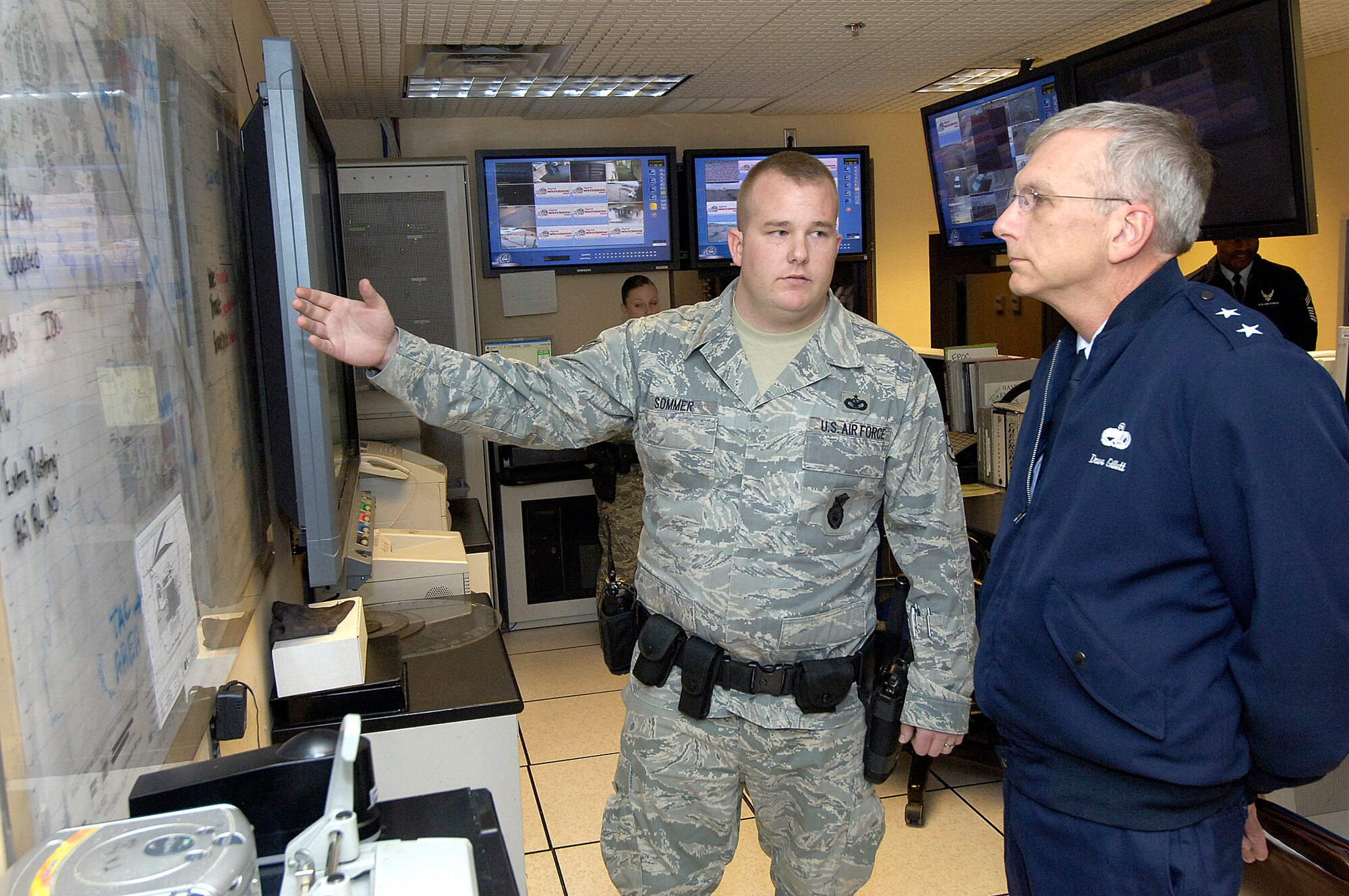 Staff Sgt. Christian Sommer explains some of the 72nd Security Forces Squadron’s protection measures for Tinker to General Gillett during a 72nd Air Base Wing orientation visit soon after the general assumed command. (Air Force photo/Margo Wright)