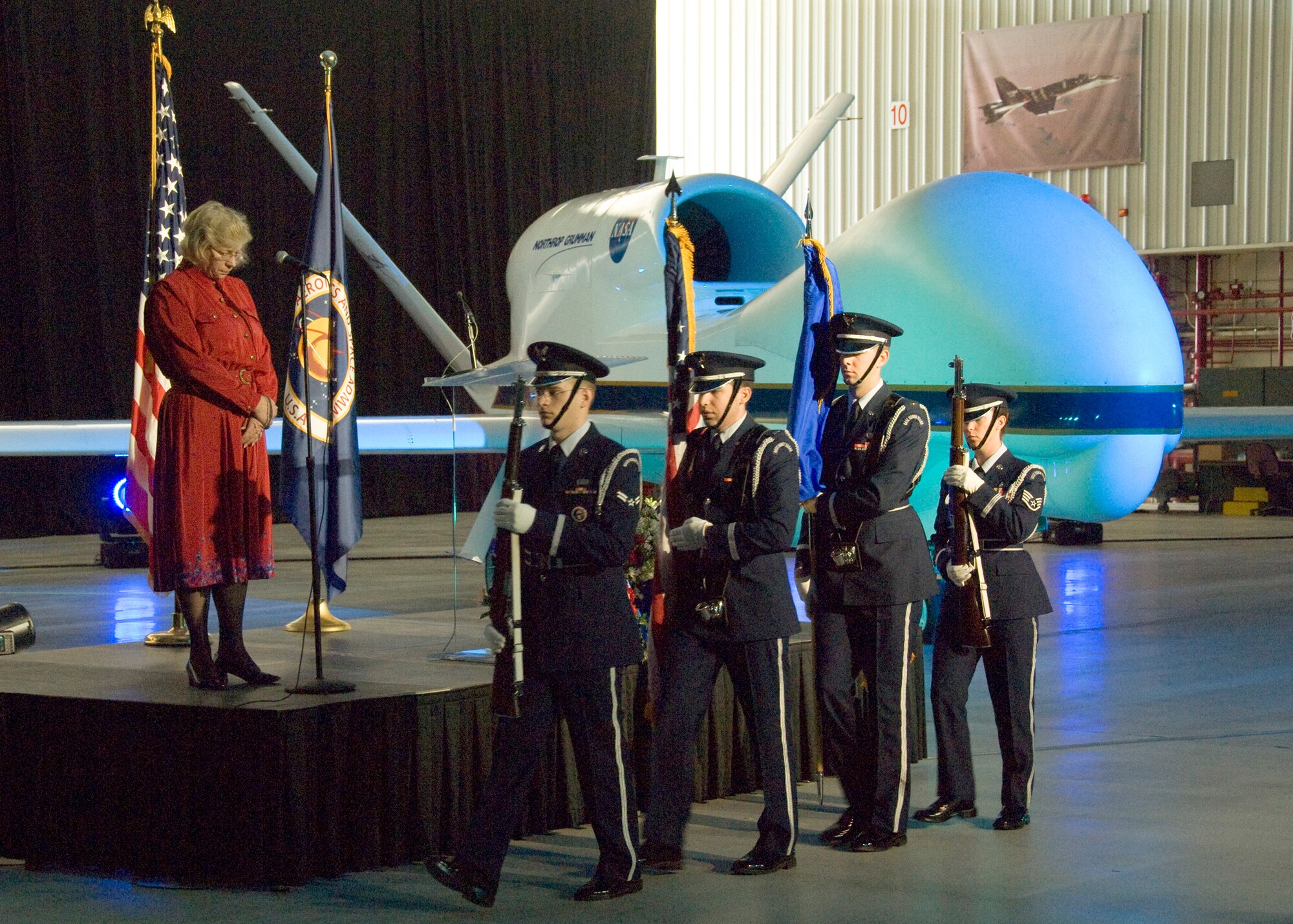 The Blue Eagles Honor Guard opens the debut ceremony of the Global Hawk at the NASA Dryden Flight Research Center Jan. 15. The aircraft is the first of two early developmental models of the autonomously operated Global Hawk aircraft that were turned over to NASA Dryden by the Air Force in late 2007. They are being brought back to airworthy status by Dryden and Northrop Grumman for use on environmental science and unmanned aircraft system technology development missions. (courtesy photo)
