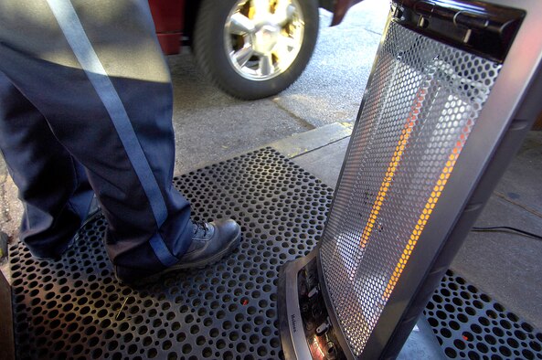 Space heaters are prized possessions at the gates.  Not all gates have heaters and heavy traffic times don’t always allow guards to tuck into the shacks for a break from the winter wind, rain or snow. (Air Force photo/Margo Wright)