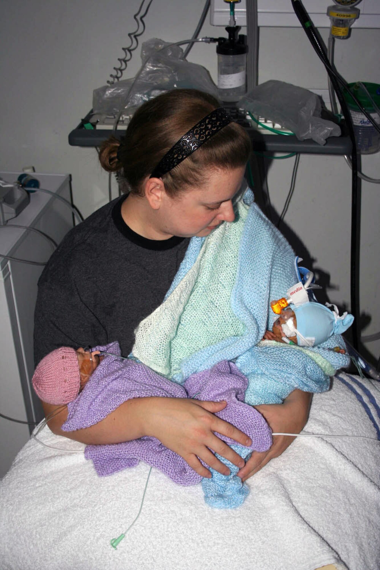Mandy Frazier holds her premature twins at the neonatal intensive care unit in November at Norfolk and Norwich Hospital in England. The twins were born Sept. 6, almost four months prematurely. Her daughter, Alexis Rain, (left) weighed just 1 pound, 3 ounces, and her son, Eric, weighed 1 pound, 5 ounces. Eric died Dec. 10 after suffering serious health problems. Mandy is the wife of Tech. Sgt. Barry Frazier of the 100th Air Refueling Wing legal office at Royal Air Force Base Mildenhall, England. (Courtesy photo) 
