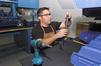 12/29/2008 - Tech. Sgt. Les Huddleston assembles the lower receiver on an M16A2 rifle at the Lackland gunsmith shop. (USAF photo by Alan Boedeker)                               