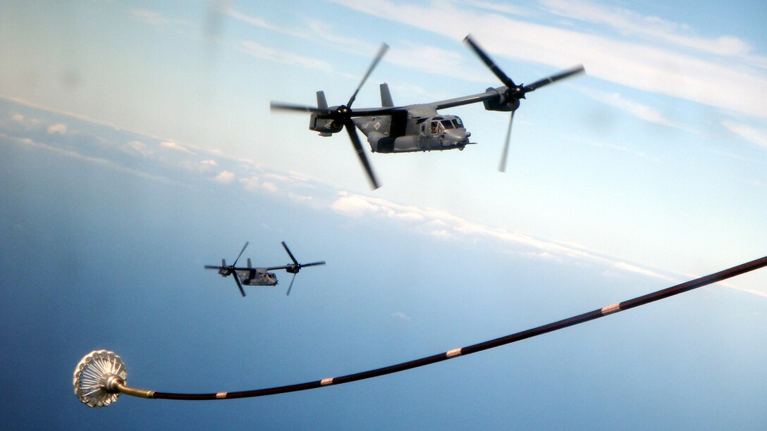 Two CV-22 Ospreys from the 8th Special Operations Squadron, Hurlburt Field, Fla., await refueling by an MC-130P Combat Shadow from the 67th Special Operations Squadron during a training
mission over Mali, Africa, Oct. 29, 2008. The aircraft were in Mali supporting Exercise Flintlock, which also served as the Osprey's first operational deployment. (U.S. Air Force photo/Tech. Sgt. Armando Carrion)                         