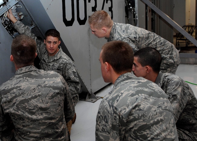 Tech. Sgt. Cameron Leslie shows the class an integrated flight control module which manages the rudder or movement of the C-17 on Charleston AFB Jan. 20. For fiscal year 2008, five instructors from the training detachment taught a total of 5,678 hours, graduating 52 new C-17 crew chiefs. Sergeant Leslie is an instructor with the 373rd Training Squadron Detachment 5. (U.S. Air Force photo/Senior Airman Katie Gieratz)