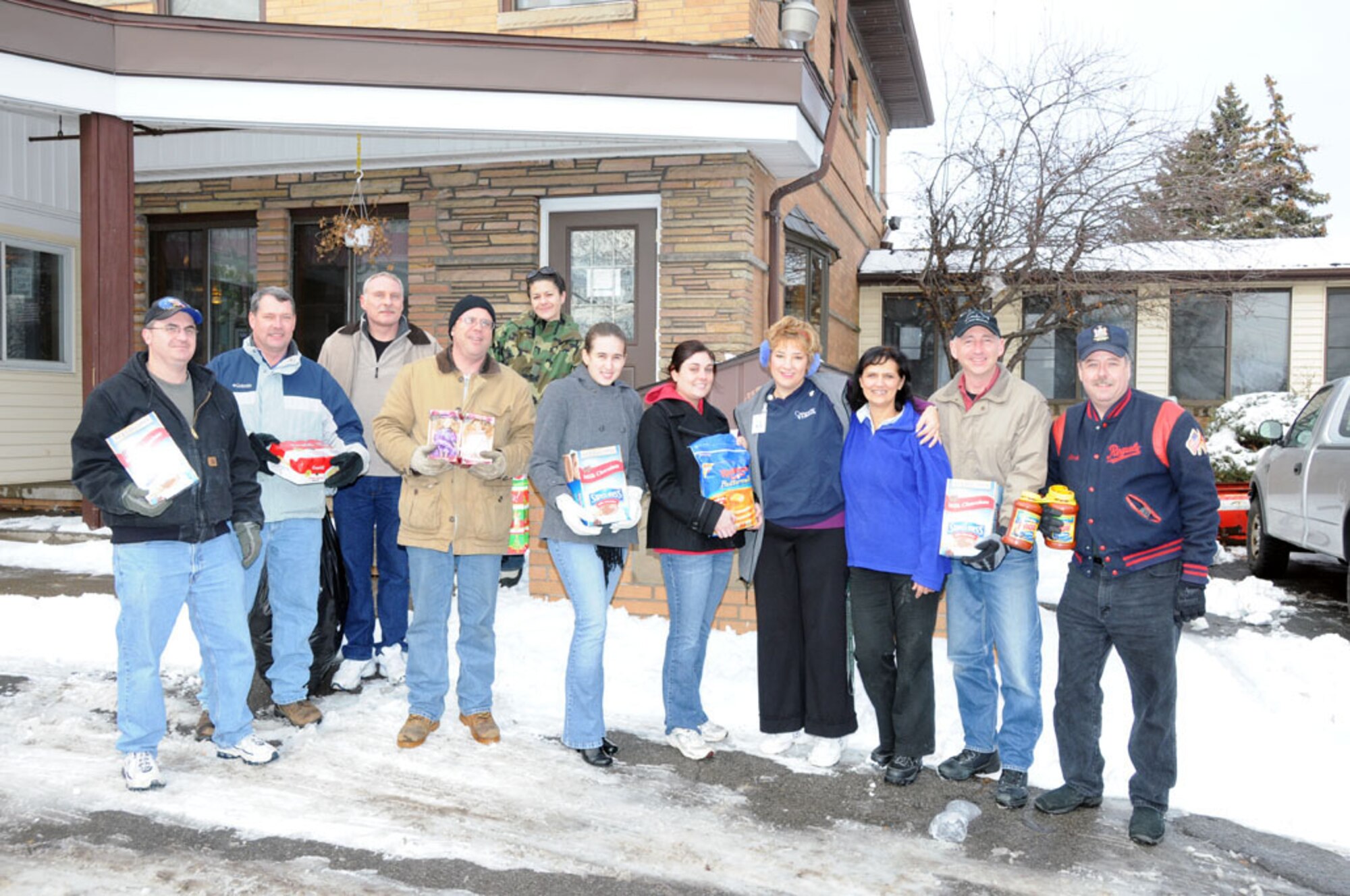 107th members stand in front of Community Missions in Niagara Falls during a donation drop off on December 16.