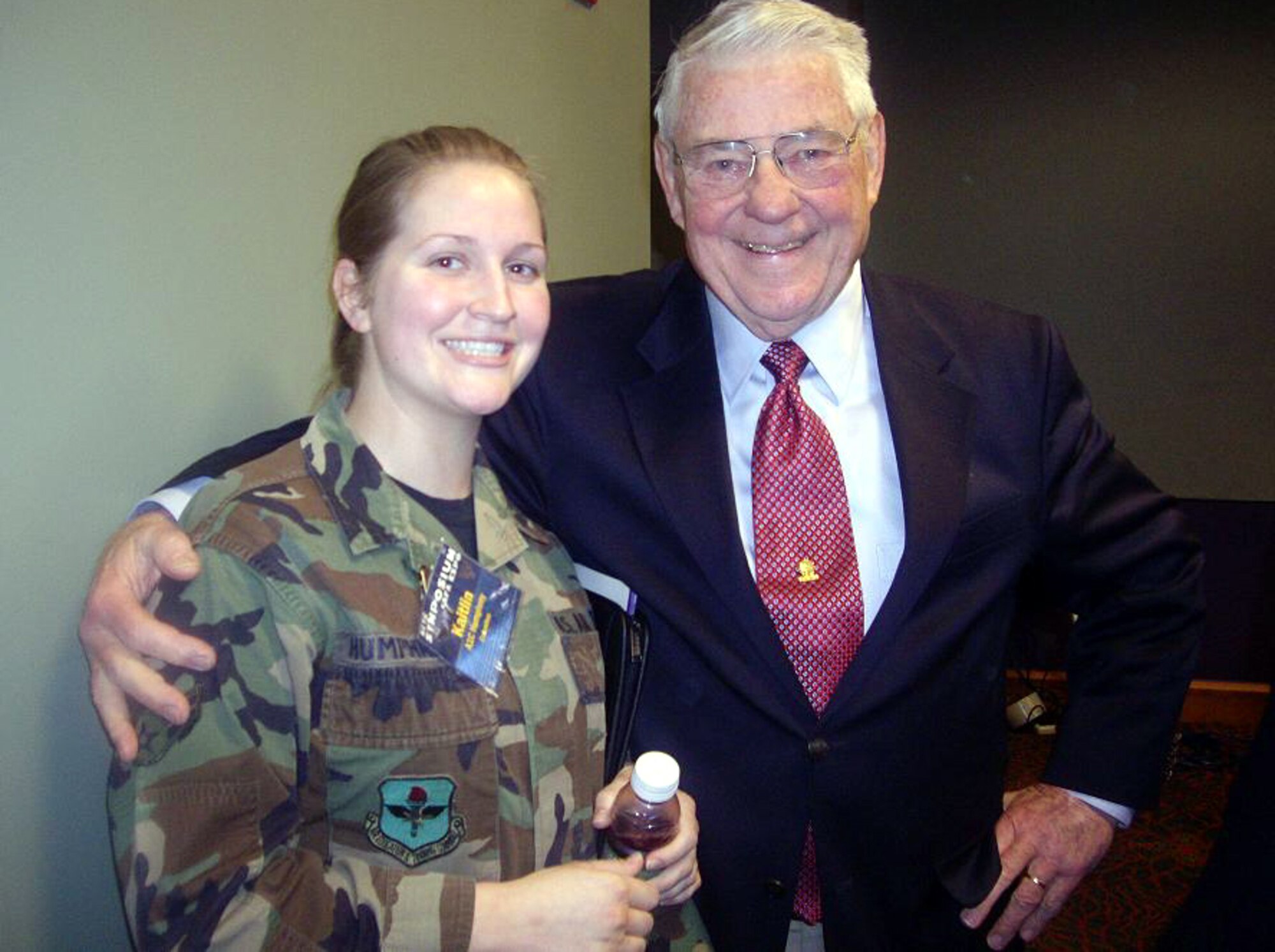Robert Gaylor, former Chief Master Sergeant of the Air Force and Airman 1st Class Kaitlin Humphrey, 14th Force Support Squadron, pose together for a photo during the Air Education and Training Command Symposium. The retired chief Gaylor was part of a panel discussing the advances in technology from the time he was young Airman and the difference now with today's Airman. (Courtesy photo)