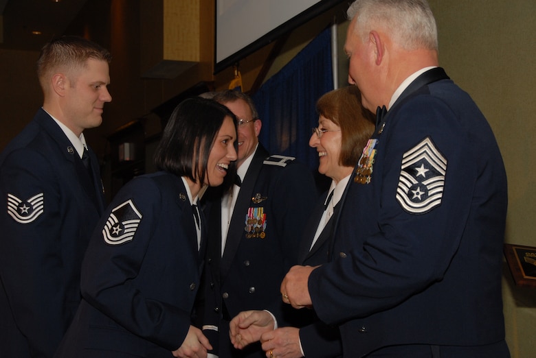 Master Sgt. Tanya Augdahl shakes hands with State Command Chief, Chief Master Sgt. Paula Johnson at the Outstanding Airman of the Year banquet on Jan 17th.  Master Sgt. Tanya Augdahl and Tech.Sgt.Jason Augdahl received the honor of Outstanding Family of the Year for 2008.  The Augdahls are part of the 219th Security Forces Air Guard Squadron located at Minot Air Force Base.