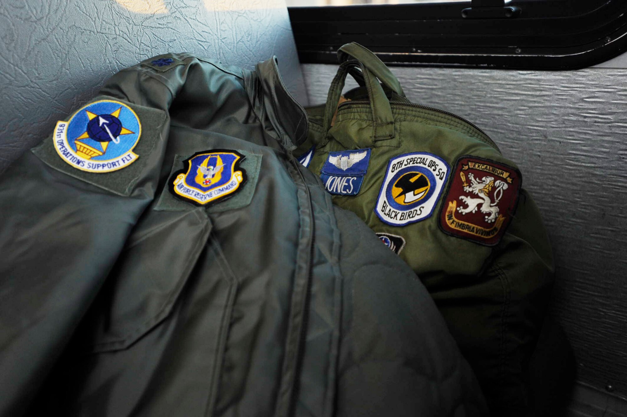 Lt. Col. Barry Jones' jacket and bag sit in an empty bus seat during a trip to the flightline at McConnell Air Force Base, Kan. The patches on his bag represent Colonel Jones' variety of Air Force experience. He was an MC-130 copilot while assigned to the 8th Special Operations Squadron at Hurlburt Field, Fla., from June, 1992, to September, 1993. (U.S. Air Force photo/Tech. Sgt. Jason Schaap)