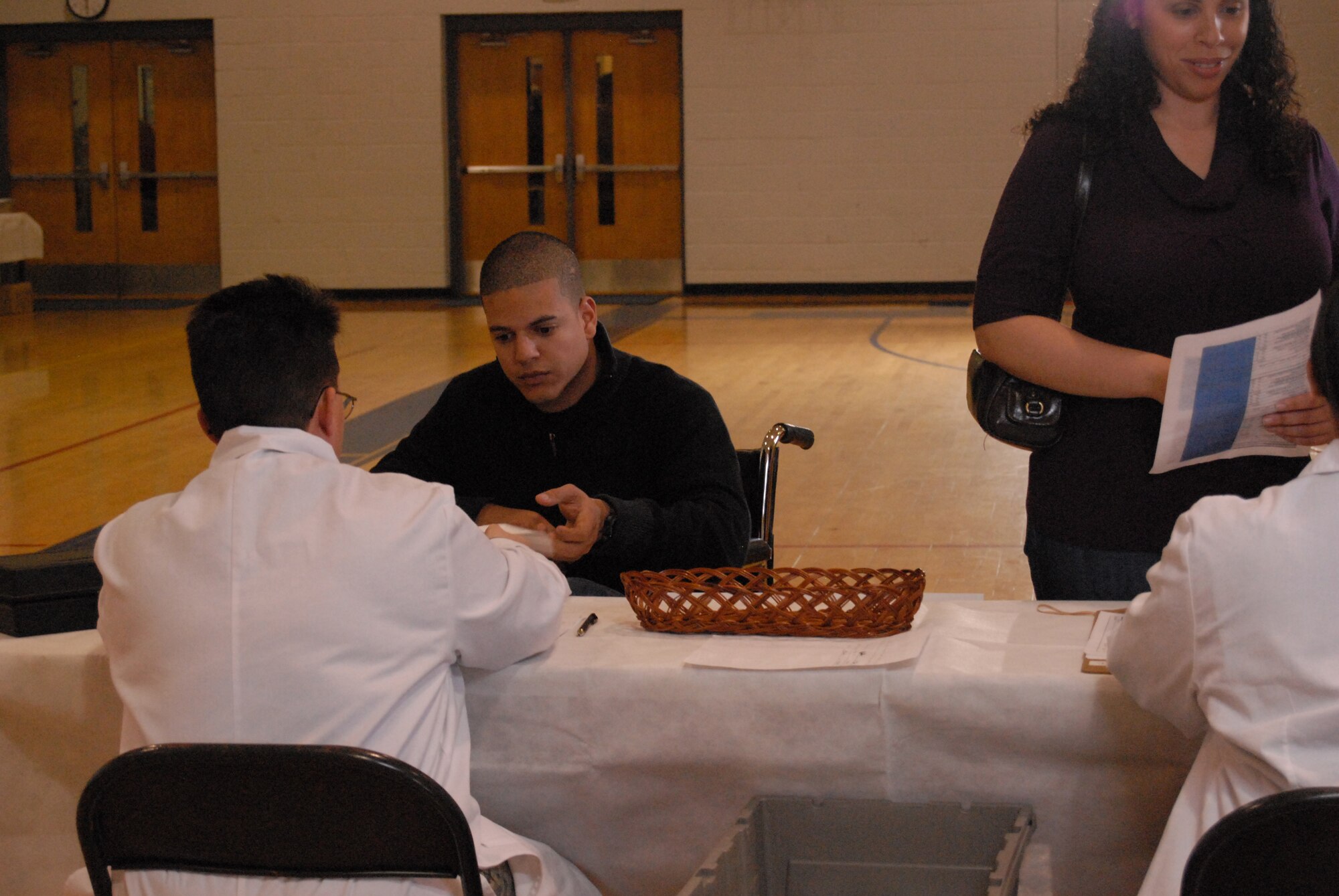Senior Airman Christian Pagan, 43rd Force Support Squadron, plays a character in a fictional situation who needs medicine after the pneumonic plague breaks out. (U.S. Air Force Photo by Airman 1st Class Mindy Bloem)