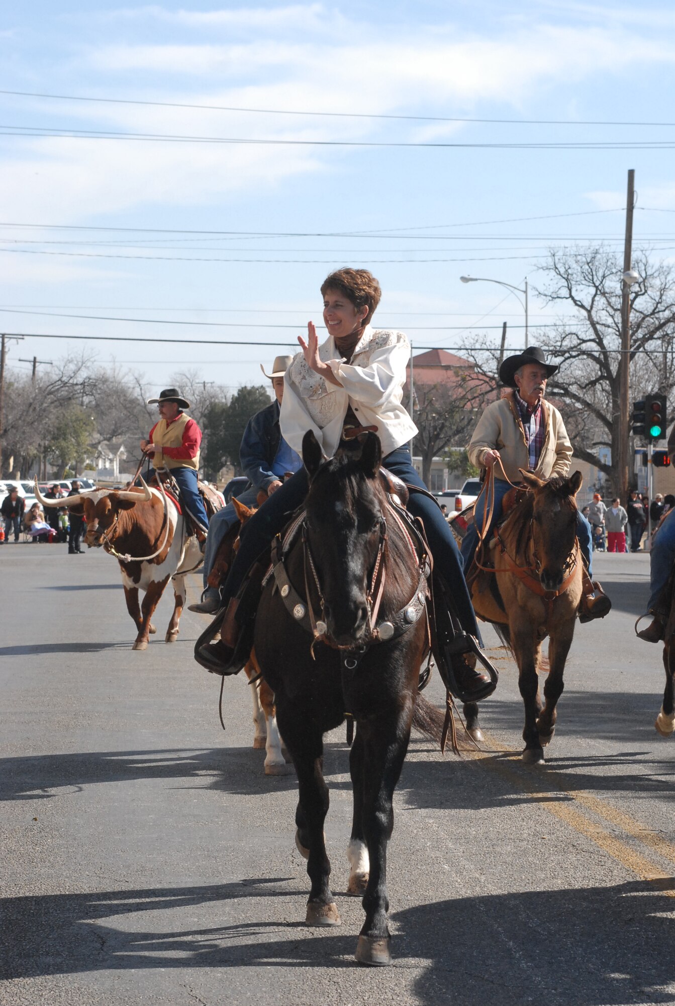 Colonel Merrily Madero, 17th Training Wing vice commander, rides a stallion, Lance, during the 2008 San Angelo Stock Show and Rodeo Parade. Colonel Madero will head to her next assignment at Randolph Air Force Base, Texas, in April. (U.S. Air Force photo by Staff Sgt. Angela Malek)