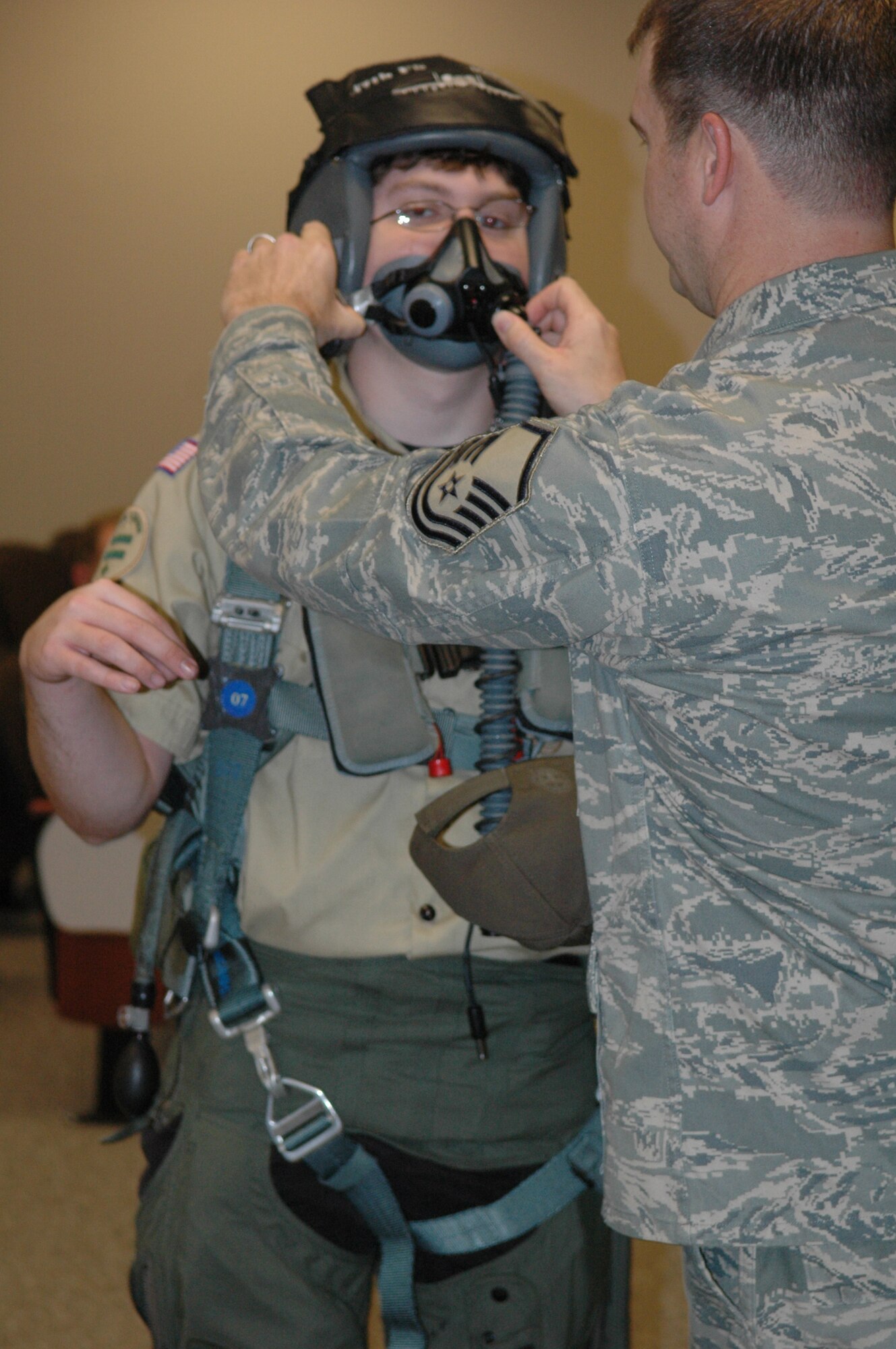 aul Eudaley, a Boy Scout in Troop 531 from Angleton, Texas, is fitted with an oxygen mask during a briefing on pilots survival exquipment by the Master Sgt. Steve Shockley, 917th Life Support. The Scouts visited the 917th Wing during the unit training assembly in January. (U.S. Air Force Photos/Mrs. Betty Stephens)  