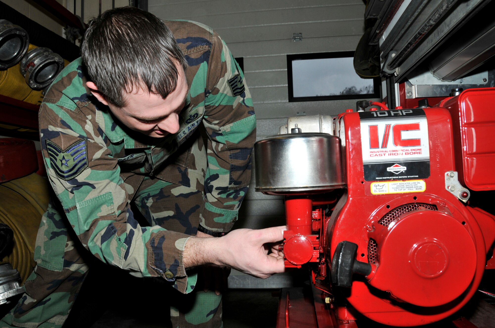 Tech. Sgt. Daniel Parker, 48th Civil Engineer Squadron firefighter, inspects the generator Jan. 22 at RAF Lakenheath, England. The fire engines and the equipment on them must be inspected before the start of every shift to ensure they will function when an incident occurs. (U.S. Air Force photo by Airman 1st Class Perry Aston) 