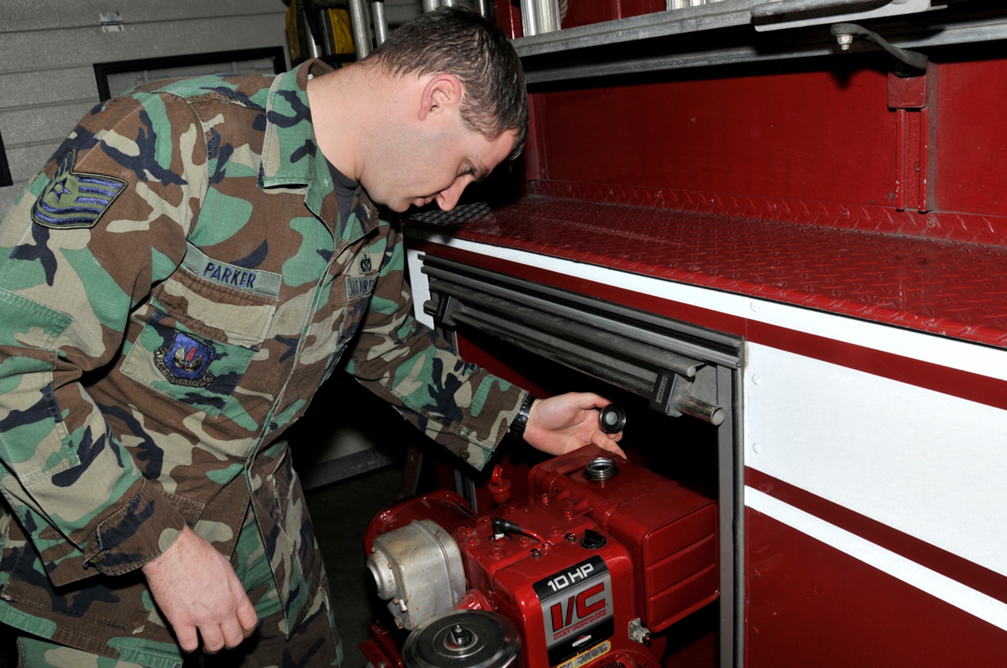 Tech. Sgt. Daniel Parker, 48th Civil Engineer Squadron firefighter, checks the fuel level of the generator Jan. 22 at RAF Lakenheath, England. The generator is used to power the scene lights when the apparatus is at an incident. (U.S. Air Force photo by Airman 1st Class Perry Aston) 