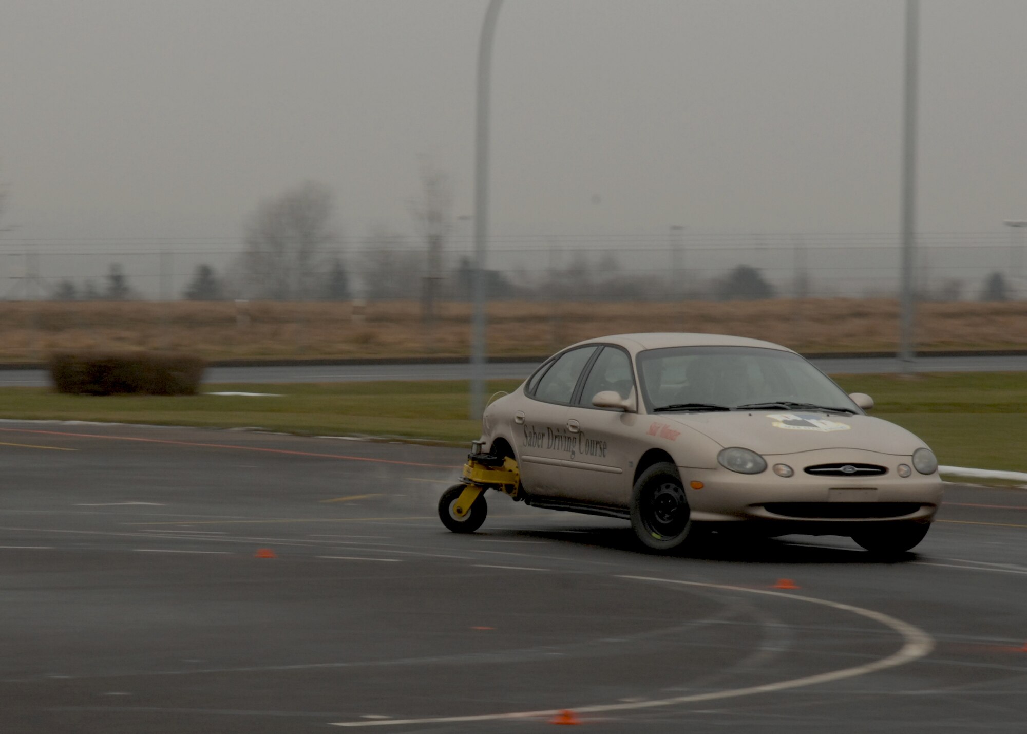 SPANGDAHLEM AIR BASE, Germany – Master Sgt. Seldon Smith, a traffic safety monitor with the 52nd Fighter Wing Safety Office, teaches a group of students how to drive the “Skid Monster”, a vehicle designed to simulate typical driving situations where the driver could lose control. (U.S. Air Force photo by Airman Staci Miller)

