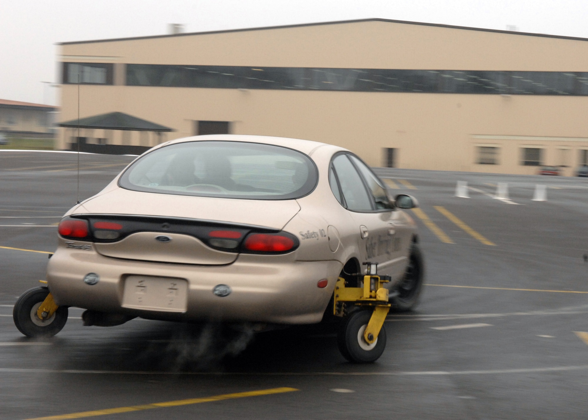 SPANGDAHLEM AIR BASE, Germany – Master Sgt. Seldon Smith, a traffic safety monitor with the 52nd Fighter Wing Safety Office, teaches a group of students how to drive the “Skid Monster”, a vehicle designed to simulate typical driving situations where the driver could lose control. (U.S. Air Force photo by Airman Staci Miller)

