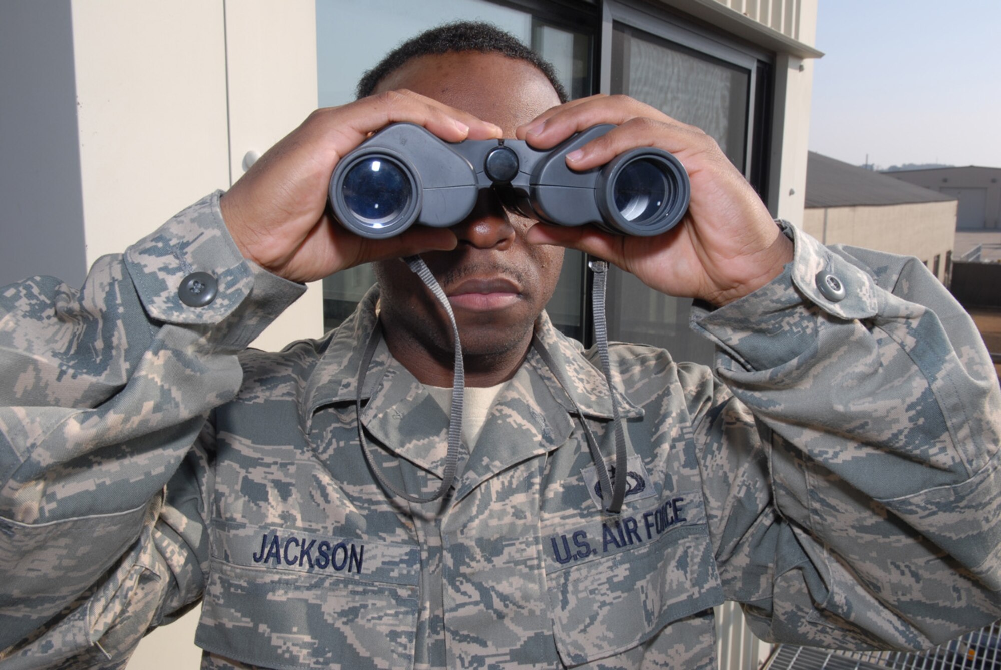 Staff Sgt. Adrian Jackson, 8th Operations Support Squadron Airfield Weather Flight, makes a a visual observation of the air field at Kunsan Air Base, Republic of Korea, Jan. 22, 2009. Sergeant Jackson provides the pilots with the visibility for that day so they can plan their missions accordingly.(US Air Force Photo By Senior Airman Angela Ruiz)
 
