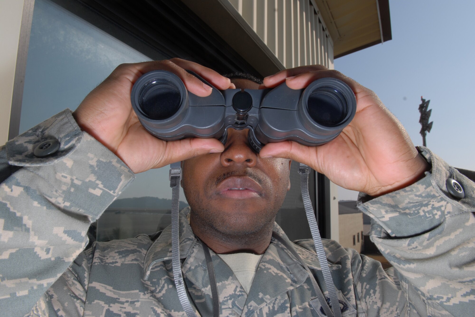 Staff Sgt. Adrian Jackson, 8th Operations Support Squadron Airfield Weather Flight, makes a a visual observation of the air field at Kunsan Air Base, Republic of Korea, Jan. 22, 2009. Sergeant Jackson provides the pilots with the visibility for that day so they can plan their missions accordingly.(US Air Force Photo By Senior Airman Angela Ruiz)
 