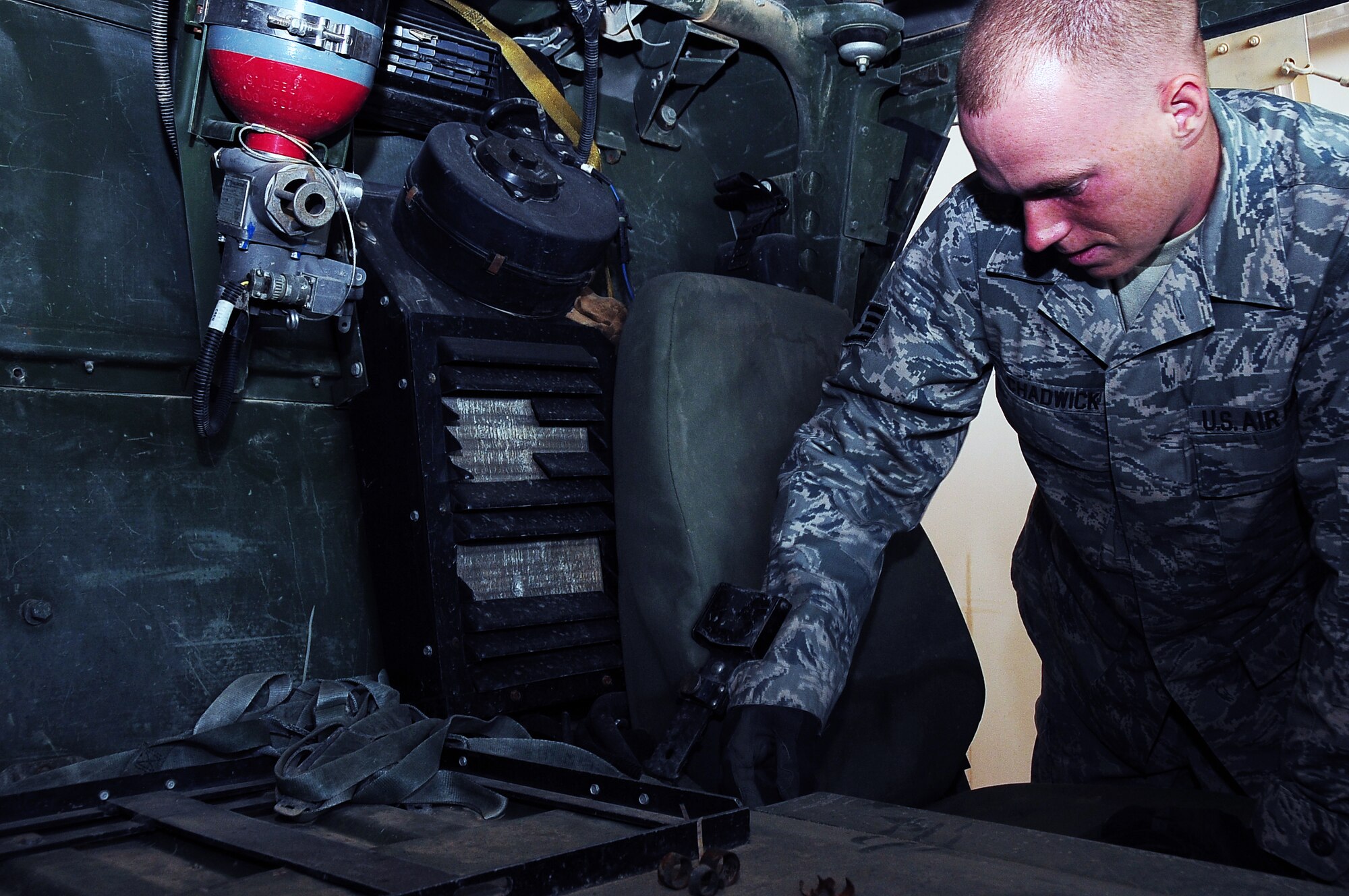 ALI BASE, Iraq –Staff Sgt. Scott Chadwick, 402nd Redistribution Property Assessment Team, inspects the inside of a Humvee for excess items Jan. 21.  The 402nd RPAT team inspects and processes U.S. military Humvees marked for redistribution to the Iraqi army.   Sergeant Chadwick is deployed here from Dover Air Force Base, Del.  (U.S. Air Force photo/Staff Sgt. Christopher Marasky)