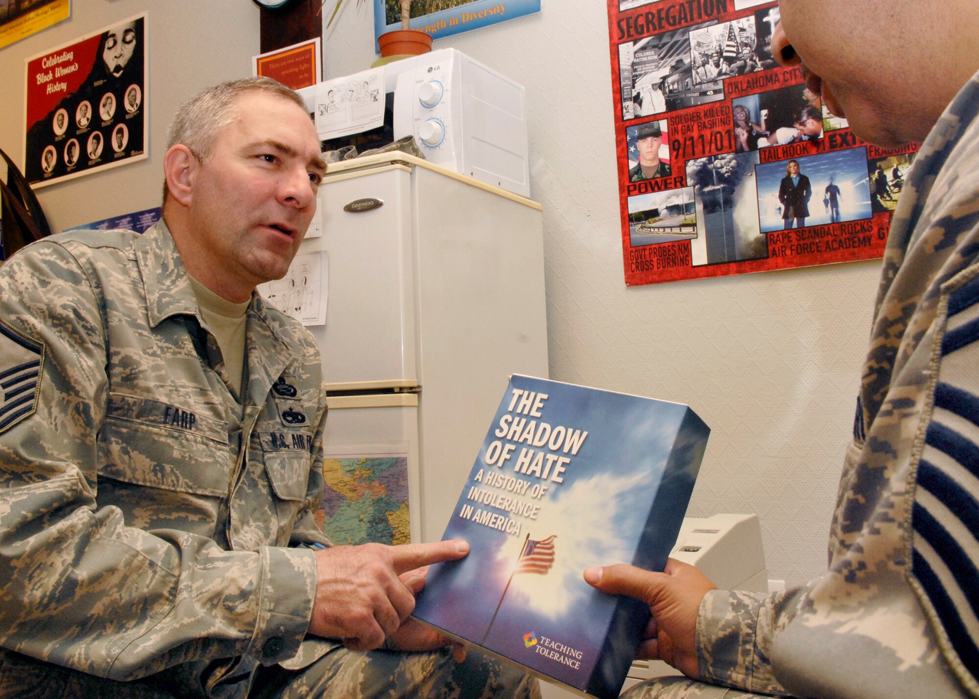 Master Sergeant Alvin Earp, the 379th Air Expeditionary Wing Director of Equal Opportunity, identifies educational material Airmen can benefit from concerning issues of racism, Jan. 21, 2009, at an undisclosed location in Southwest Asia.  Master Sgt. Earp counsels Airmen about racism and sexual harassment and to help Airmen get further assistance from the proper agencies on base.  Master Sgt. Earp hails from Trion, Ga. and is deployed from Moody Air Force Base, Ga. in support of Operation Iraqi and Enduring Freedom and Joint Task Force- Horn of Africa.  (U.S. Air Force Photo by Airman 1st Class Andrew Satran/Released)