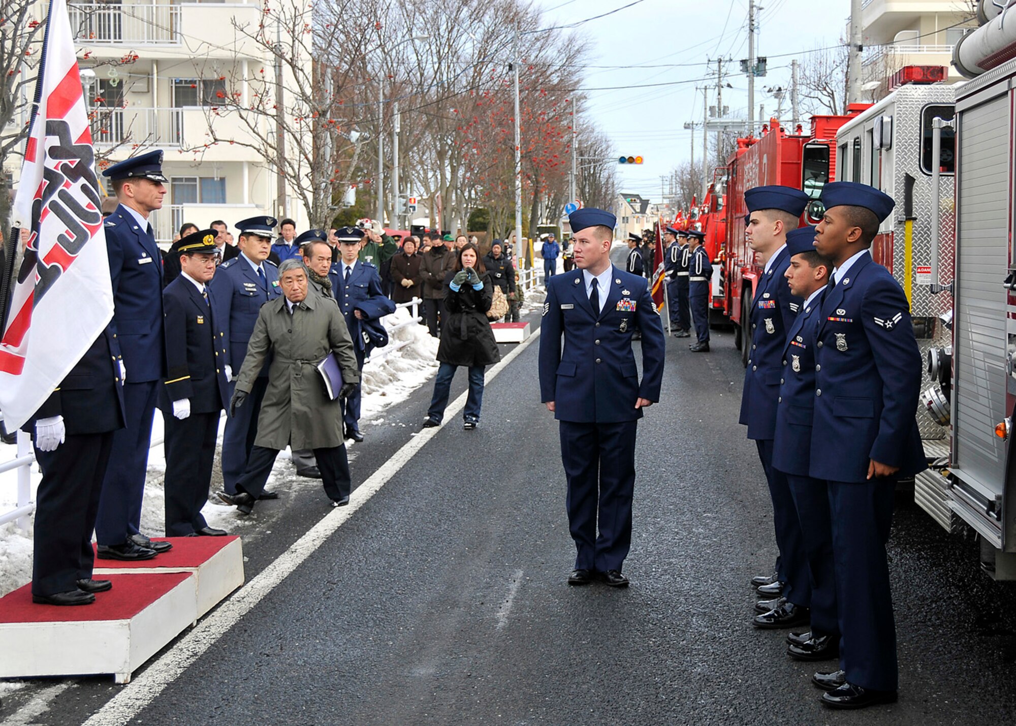 MISAWA CITY, Japan -- Staff Sgt. Eric Moses, 35th Civil Engineer Squadron, reports to Col. David Stilwell, 35th Fighter Wing commander, during a fire truck review Jan. 18, 2009. About 15 fire departments were inspected during the ceremony. (U.S. Air Force photo by Senior Airman Chad Strohmeyer)