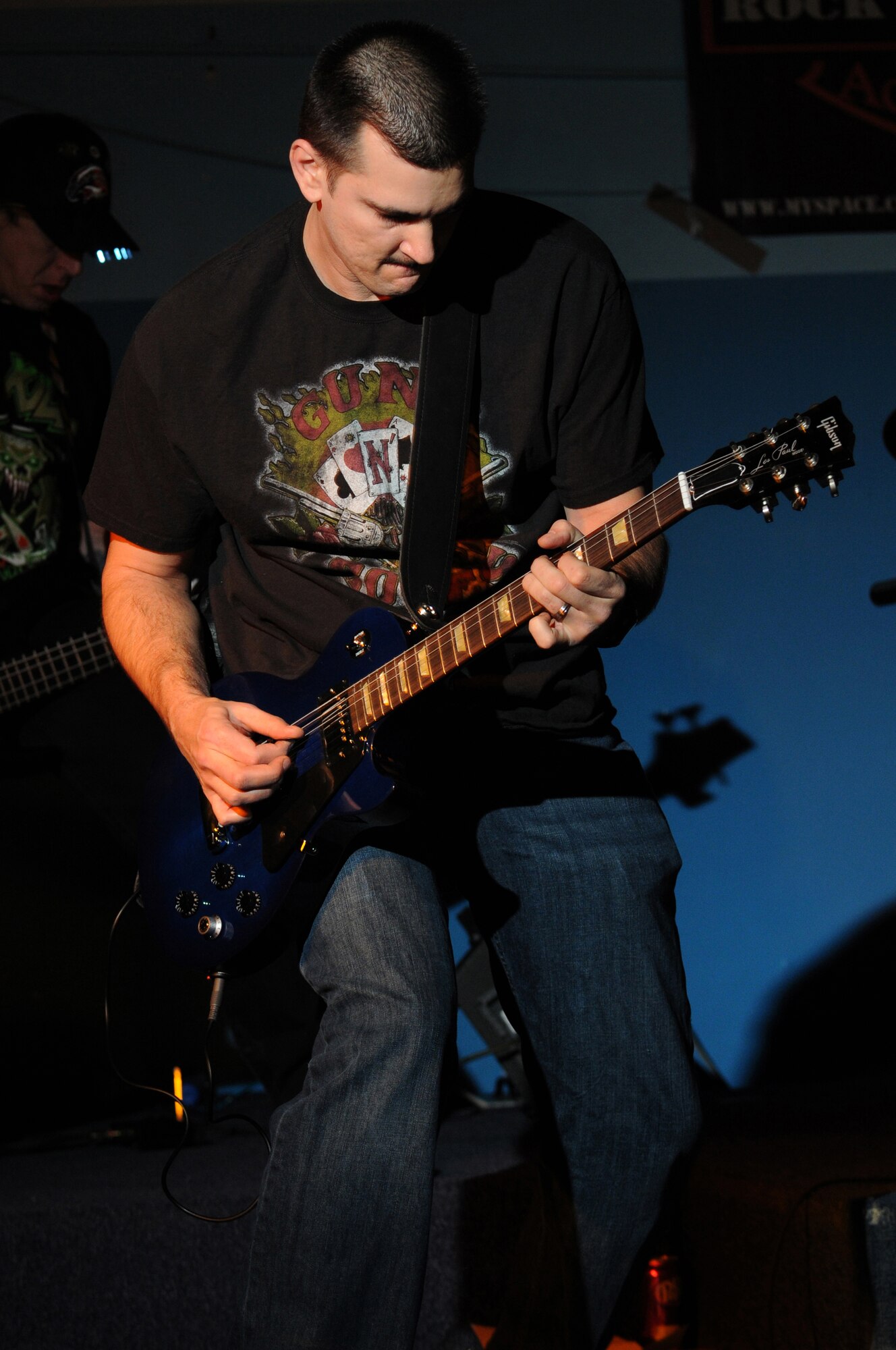 Master Sgt. Tom Pitman, lead guitarist of the band Friction Addiction, performs at the Battle of the Bands event Jan. 16, 2009, on Ramstein Air Base. The event was sponsored by Armed Forces Against Drunk Driving. (U.S. Air Force photo by Senior Airman Nathan Lipscomb) 