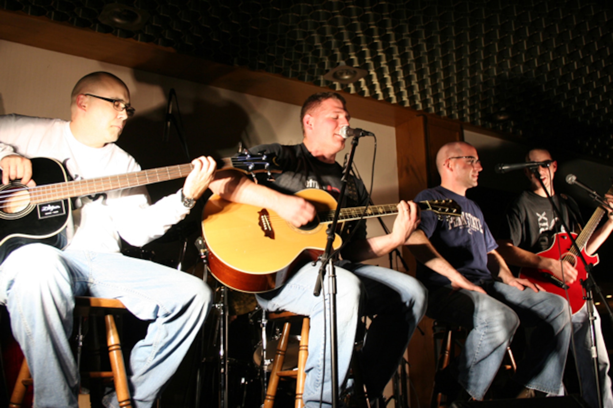 SEMBACK AIR BASE, Germany -- Members of the Griswold's, from left to right, Tech. Sgt. Steve McConnell, Staff Sgt. Russell Beye, Staff Sgt. Mike Daniels and Airman 1st Class Paul Weathersby, perform at a local pub to support the Landstuhl Medical Center’s Fisher House. The four Airmen are members of the 21st Operational Weather Squadron here and together with Staff Sgt. Ben Comer, 86th Aircraft Maintenance Squadron at Ramstein Air Base, Germany, raised $1,500 for the nonprofit organization. (Courtesy photo)
