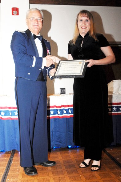 Ms. Becky D. Dutcher of 452 Security Forces Squadron receives her award for Civilian of the Quarter, 3rd QTR. in the GS-01-GS-06 category. Jan. 10, 2009. (U.S.Air Force photo by Tech. Sgt. Elizabeth Concepcion)