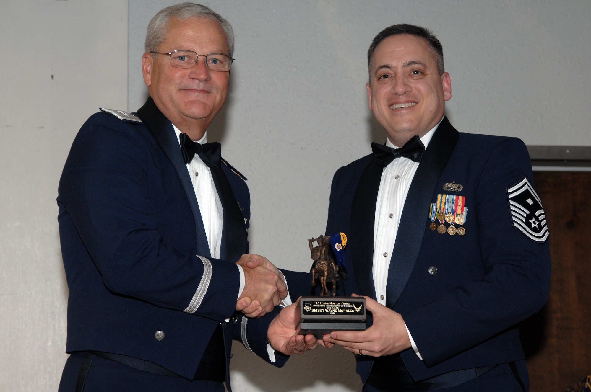 Senior Master Sgt. Wayne Morales  of the 752 AMXS recieves his award for Outstanding First Sergeant of the Year from Brig. Gen. James L. Melin, commander, 452 AMW on Jan. 10,  2009. (U.S. Air photo by Tech. Sgt. Elizabeth Concepcion)
