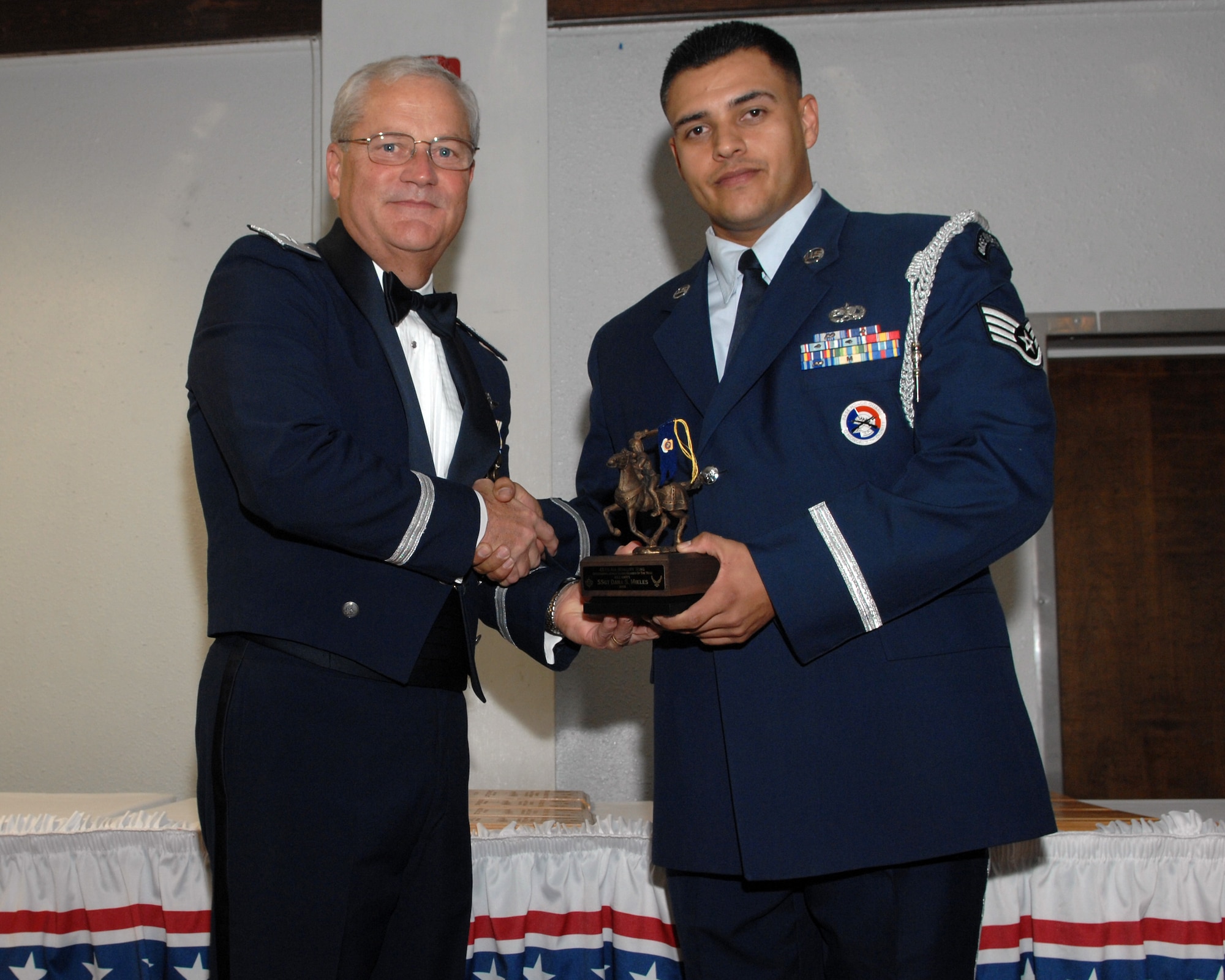 Staff Sgt. Dana Mikels of the 452 AMXS recieves his award for Outstanding Honor Guard Member of the Quarter, 2nd QTR. Jan. 10,  2009 (U.S. Air Force photo by Tech. Sgt. Elizabeth Concepcion).