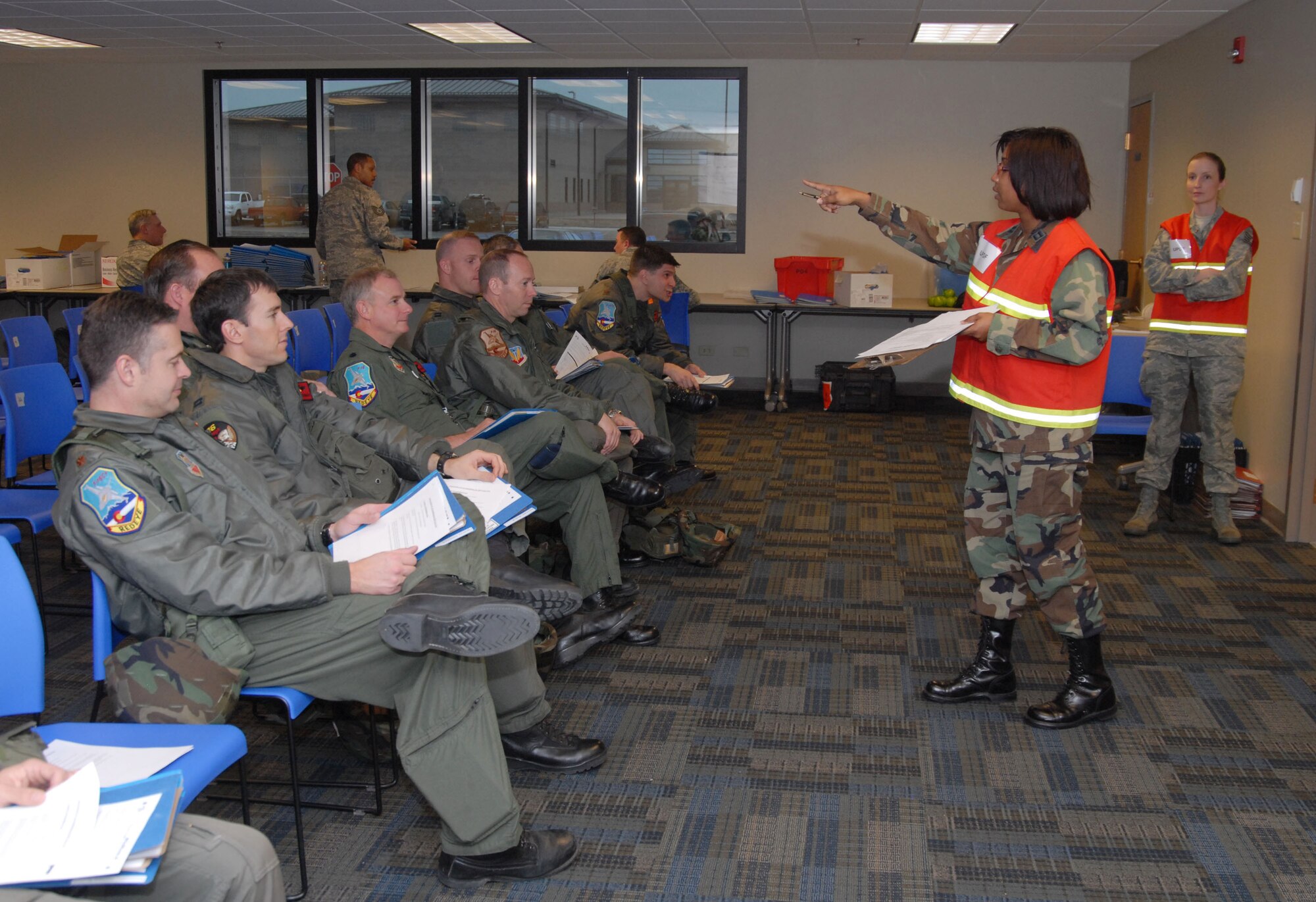 CaptainTabatha Johnson, from the 140th Wing's Military Equal Opportunity Office, conducts mobility training for the 120th Operations Group pilots during an Operational Readiness Exercise in preparation for an upcoming inspection.  