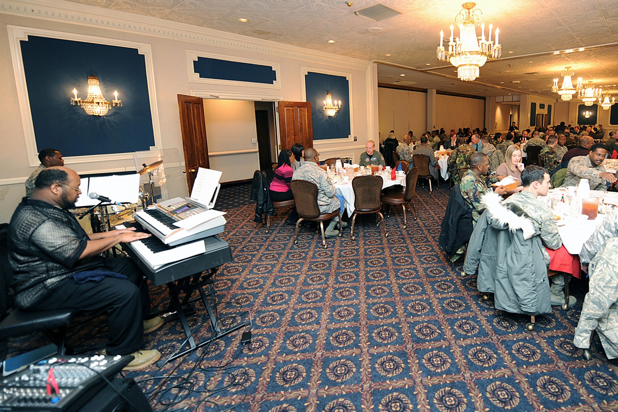 OFFUTT AIR FORCE BASE, Neb. -- Keyboardist Lawrence Kelly and Master Sgt.  Bradley Hardman, 97th Intelligence Squadron, perform for guests at the Martin Luther King, Jr. Commemorative Luncheon at the Patriot Club Jan. 16. Patrons were treated to a soul-food menu as they watched a slide show dedication to Martin Luther King, Jr. compiled by Chaplain (Capt.) Scott Nupson. Brig. Gen. (Ret) Toreaser A. Steele was the guest speaker and gave an insperational speech in honor of the late Martin Luther King, Jr.