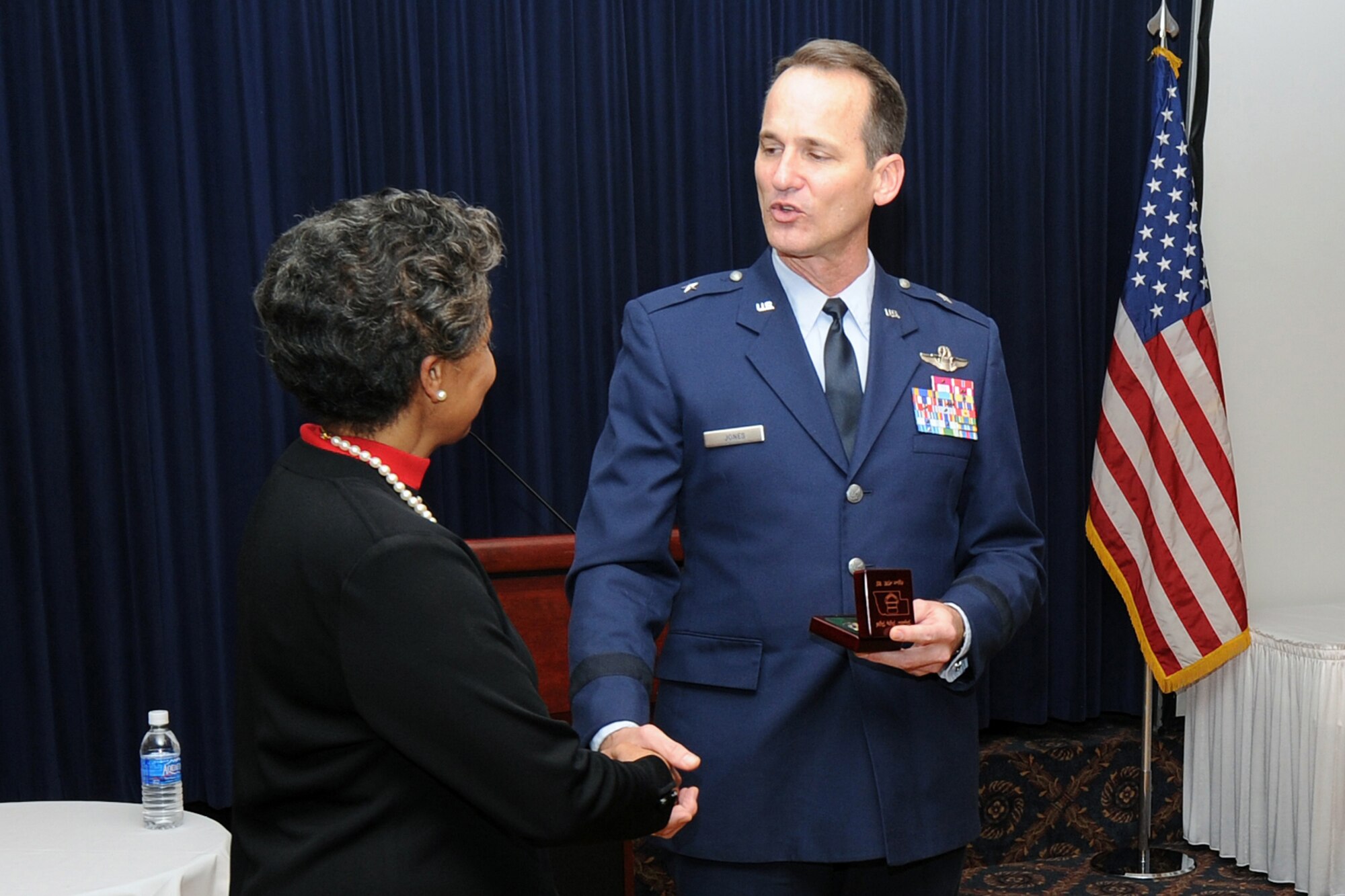 OFFUTT AIR FORCE BASE, Neb. -- Brig. Gen. (Ret) Toreaser A. Steele, the guest speaker at this year's Martin Luther King Jr. Commemorative Luncheon was presented with a coin by Brig. Gen. James Jones, 55th Wing commander, at the Patriot Club Jan. 16. Guests were treated to a soul- food menu and a touching slide show dedication to Martin Luther King, Jr. compiled by Chaplain (Capt.) Scott Nupson, 55th Wing Chapel. 