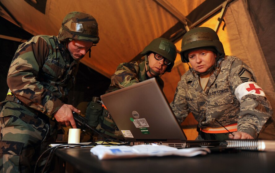 OFFUTT AIR FORCE BASE, Neb. --  Personnel from the 55th Medical Group go over the medical readiness status report inside the medical control center as part of an Operational Readiness Exercise Jan. 22.  Airmen from the 55th Medical Group gained invaluable mission experience during the three day exercise at a simulated, remote base where they are given numerous scenarios they could face while deployed. The 55th Wing is in preparation for an Operational Readiness Inspection Sept. 10-16.

U.S. Air Force Photo by Josh Plueger