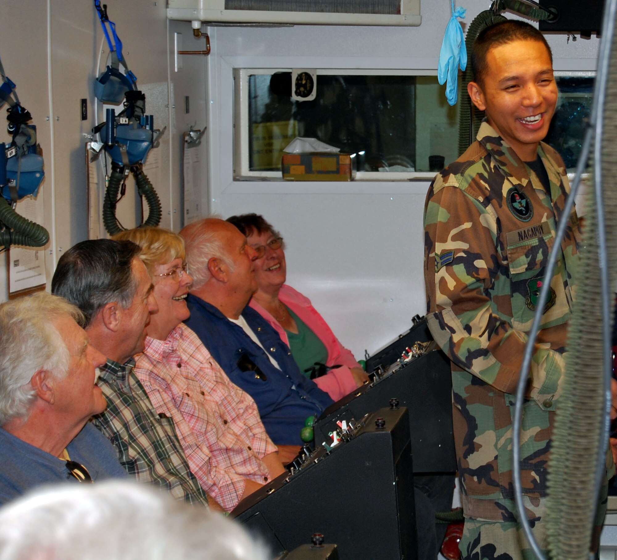 LAUGHLIN AIR FORCE BASE, Texas – Airman 1st Class Francis Nacapuy, 47th Aerospace Physiology, gives a tour group of winter visitors a lesson in aerospace physiology inside the altitude chamber Jan 22.  Base tours are being conducted by public affairs for winter visitors to Del Rio as part of a program with the Chamber of Commerce.   (U.S. Air Force photo by 2nd Lt Eric Jones)