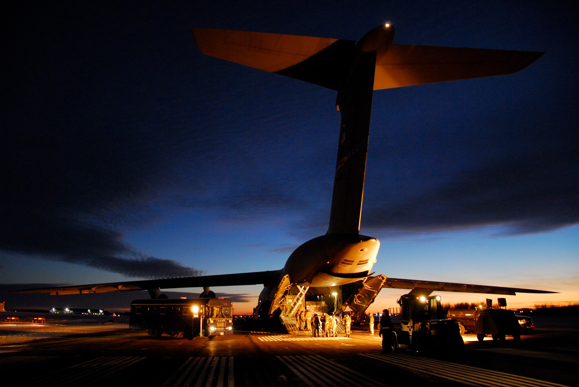 A U.S. Air Force C-5 Galaxy from Dover Air Force Base sits idle on a runway at Duluth Air National Guard Base, Minn. before it is unloaded January 20, 2009.  The aircraft transported members of the 148th Fighter Wing and equipment returning from a recent deployment to Joint Base Balad, Iraq as a part of the 148th's  Air Expeditionary Force (AEF) deployment. (U.S. Air Force photo by TSgt Jason W. Rolfe) (Released)