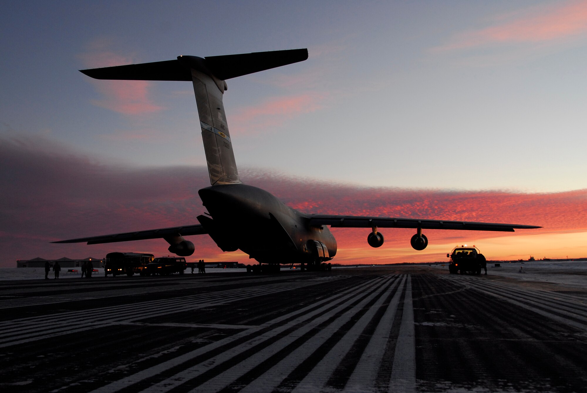 A U.S. Air Force C-5 Galaxy from Dover Air Force Base sits idle on a runway at Duluth Air National Guard Base, Minn. before it is unloaded January 20, 2009.  The aircraft transported members of the 148th Fighter Wing and equipment returning from a recent deployment to Joint Base Balad, Iraq as a part of the 148th's  Air Expeditionary Force (AEF) deployment. (U.S. Air Force photo by TSgt Jason W. Rolfe) (Released)