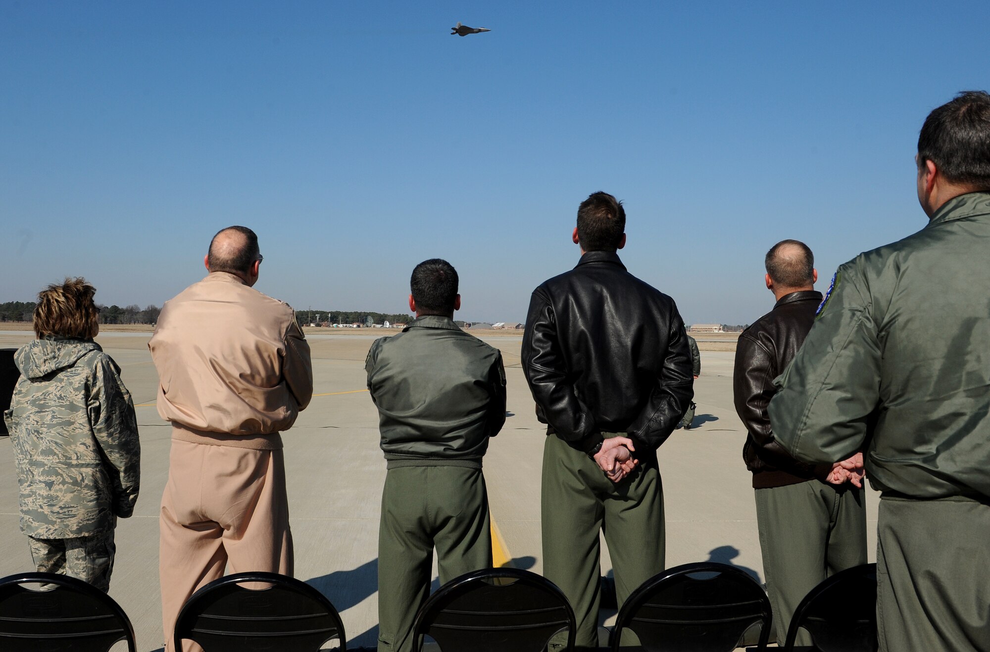 LANGLEY AIR FORCE BASE, Va. – Brig. Gen. Mark Barrett, 1st Fighter Wing commander, and Lt. Gen. Gary North, 9th Air Force commander, join others in watching the F-22 Raptor demonstration here Jan. 21. The certification demonstration for Gen. John D.W. Corley, commander of Air Combat Command, is scheduled for Feb. 4. (U.S. Air Force photo/Airman Rebecca Montez)