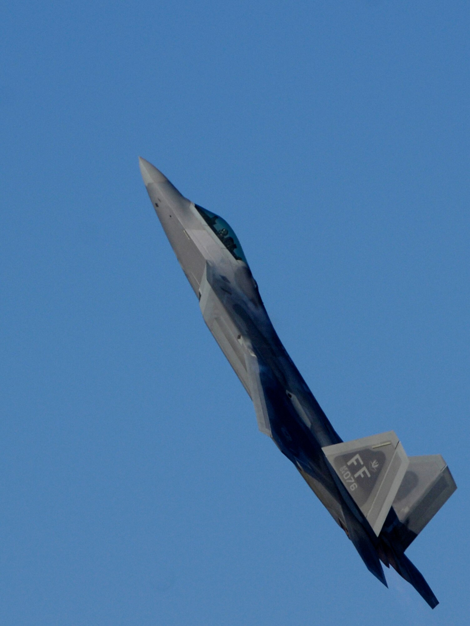 LANGLEY AIR FORCE BASE, Va. – Maj. Dave “Zeke” Skalicky, F-22 Raptor demonstration pilot, performs for certification by Brig. Gen. Mark Barrett, 1st Fighter Wing commander, and Lt. Gen. Gary North, 9th Air Force commander, here Jan. 21. The certification demonstration for Gen. John D.W. Corley, commander of Air Combat Command, is scheduled for Feb. 4. (U.S. Air Force photo/Airman Rebecca Montez)

