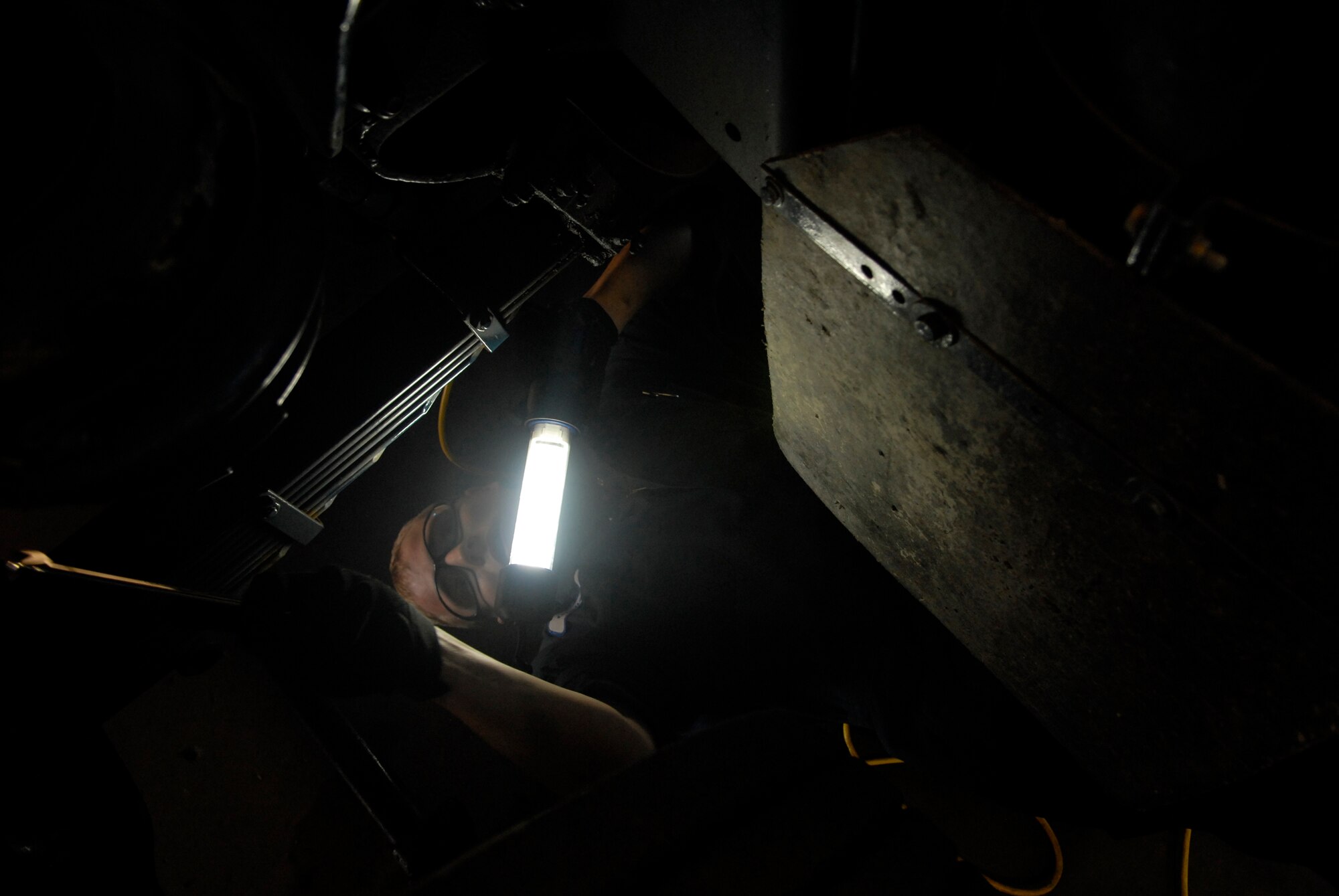 VANDENBERG AIR FORCE BASE, Calif. --  Airman 1st Class Mike Gigliotti, a vehicle mechanic with the 30th Logistics Readiness Squadron, releases a pressure valve on a vehicle on Jan. 13. (U.S. Air Force photo/Senior Airman Christian Thomas)