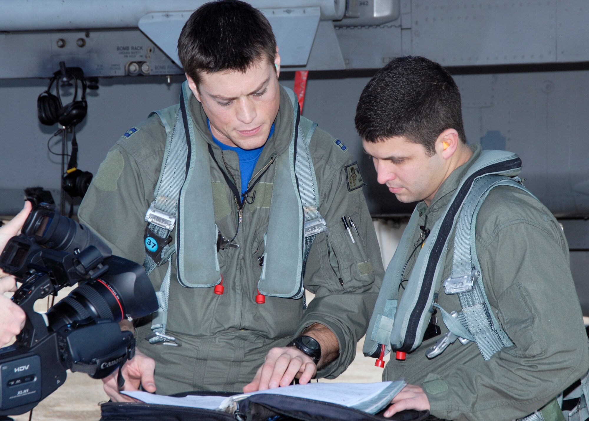Reed Sorenson, driver of the No. 43 NASCAR, prepares for take-off in an F-15 with Capt. Dustin Ripley, 95th Fighter Squadron pilot, today.  The Air Force is both a primary and associate sponsor for the No. 43 car driven by Reed Sorenson, and as a primary sponsor, the car will feature the Air Force paint scheme in four of the 38 races this season.   (U.S. Air Force photo by Isaac Gibson)