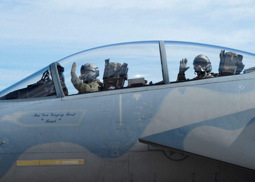 Reed Sorenson, driver of the No. 43 NASCAR, prepares for take-off in an F-15 with Capt. Dustin Ripley, 95th Fighter Squadron pilot, today.  The Air Force is both a primary and associate sponsor for the No. 43 car driven by Reed Sorenson, and as a primary sponsor, the car will feature the Air Force paint scheme in four of the 38 races this season.   (U.S. Air Force photo by Isaac Gibson)