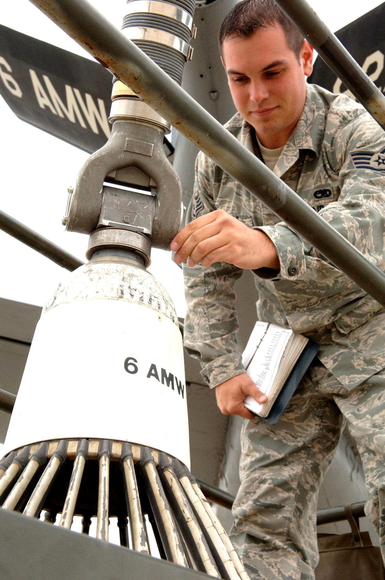Staff Sgt. Patrick Vitmvas, 6th Aircraft Maintenance Squadron crew chief, inspects a drouge attached to a KC 135 here Jan. 15. The drouge is used to refuel F-18s. The 6th Air Mobility Wing Maintenance Group participated in a Naval Composite Unit Training Exercise here from Jan. 10 until Jan. 18. 6th AMW flew eight missions in support of the COMPUTEX and offloaded 55,224 gallons of fuel to 109 receivers.