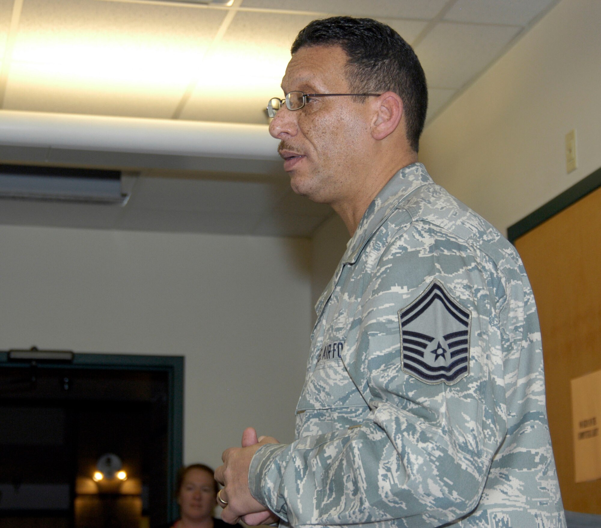 Senior Master Sgt. Ramon Roldan, DPP, speaks to a group of young people at the Denver Youth Employment Academy on Jan. 21. The YEA provides education and job training opportunities for urban youth ages 14-21 living in the city of Denver. (U.S. Air Force photo/Mike Molina) 