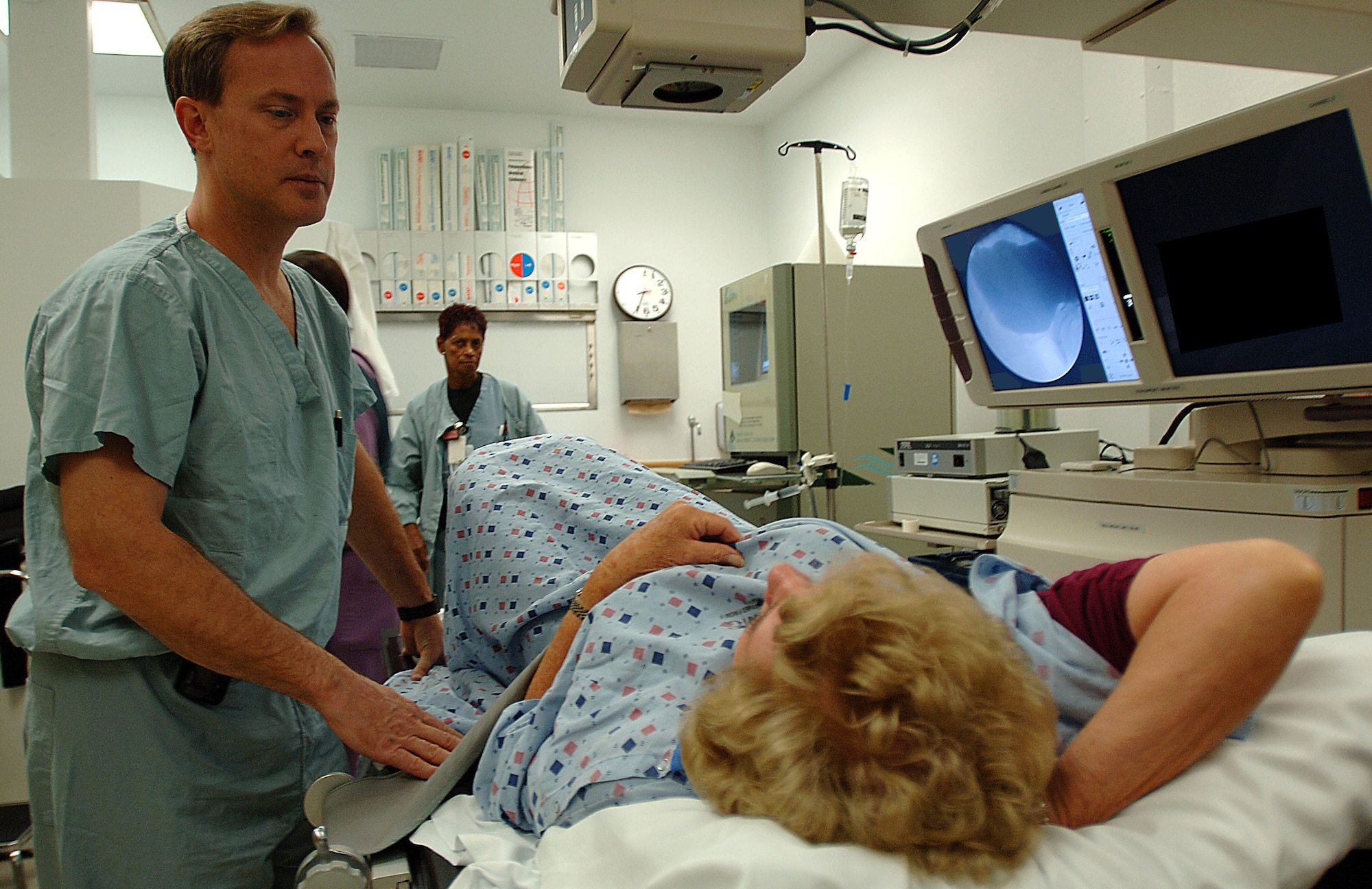 Col. (Dr.) Duane Cespedes, director of the Wilford Hall Incontinence Clinic, conducts a urodynamic study on a patient in the Wilford Hall Medical Center Urology Department. The study helps evaluate the cause of incontinence. (U.S. Air Force Photo/Senior Airman Josie Kemp) 